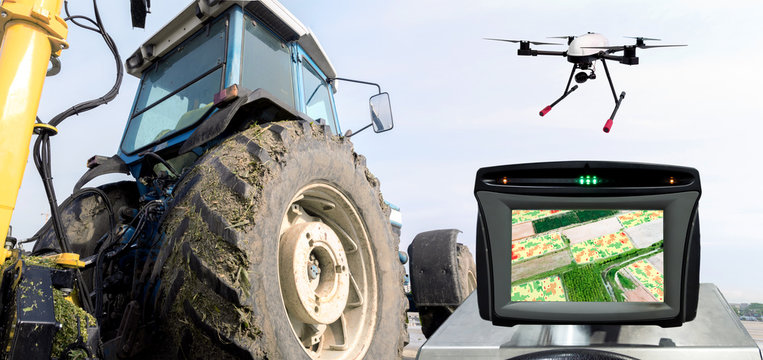 Smart agriculture , farm , precision farming concept. Automation Drone , tractor , NIR images processing application screen device create field health maps for normalize difference vegetation index.
