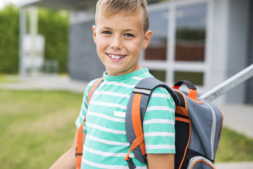Pre teen boy outside at school