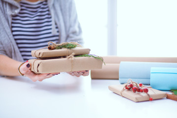 Hands of woman holding christmas gift box