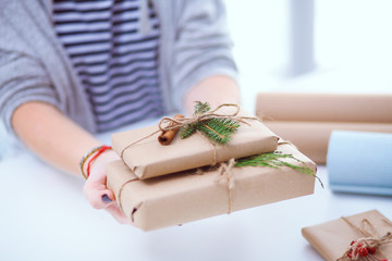 Hands of woman holding christmas gift box