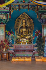 meditating golden buddha statue closeup photo