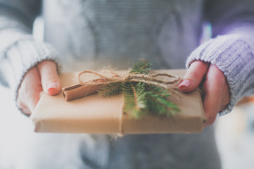 Hands of woman holding christmas gift box