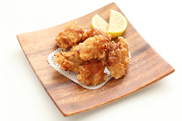 Fried chicken on wooden plate