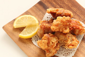 Fried chicken on wooden plate