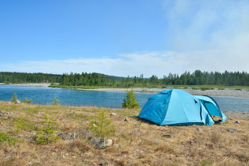 Tent tourist on the river Bank.