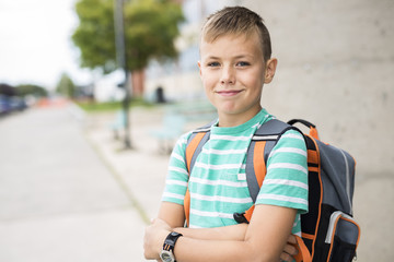 Pre teen boy outside at school