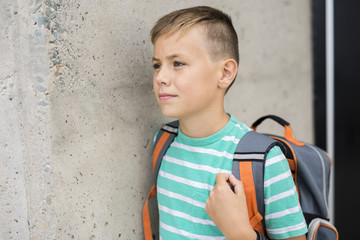 Pre teen boy outside at school