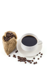 coffee cup with coffee beans on white background