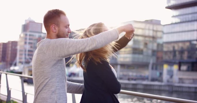 Young couple dancing romantically in the city