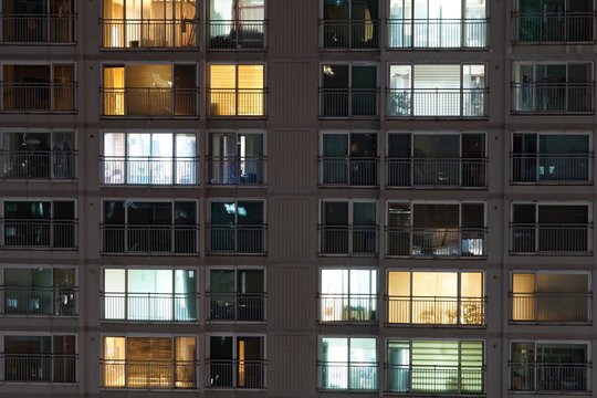 Time lapse of high-density apartment block at night.