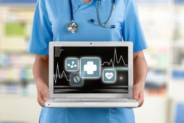 Doctor with laptop.
