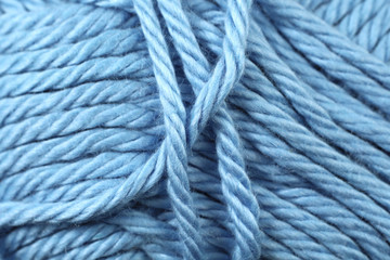 A super close up image of baby blue yarn