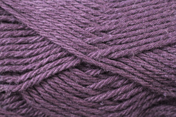 A super close up image of royal purple yarn
