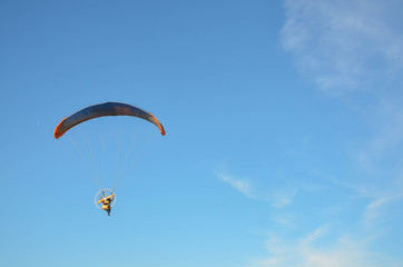 Paramotor flying on the sky