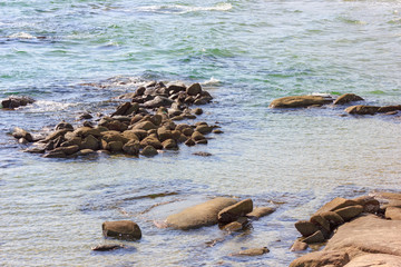 Obraz premium Stone beach of the Sea at summer day