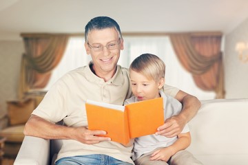 Fototapeta premium Dad and child read book.