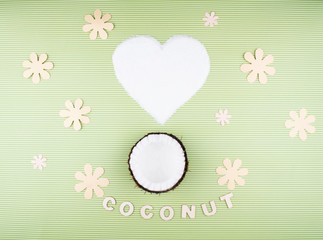 Fruits of coconuts on green background.