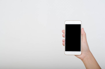 Woman hand holding smartphone with blank screen isolated on white background.