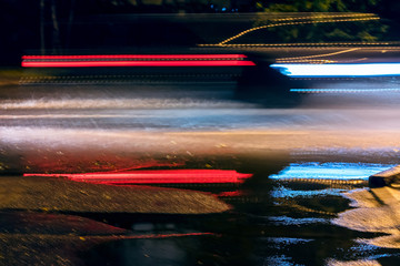 speed motion on night street. blurred car lights background.