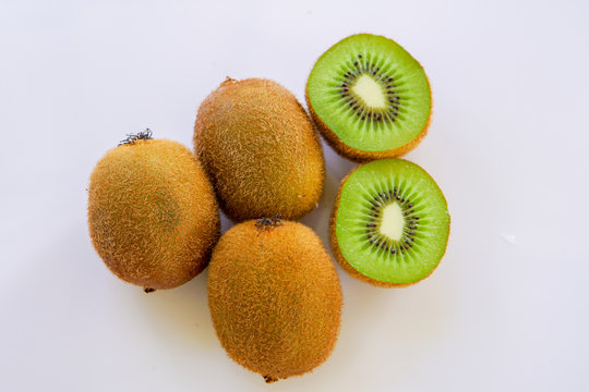 Kiwi fruit, slice of qiwi isolated on white background. Cut of green sweet kiwi. Kiwi healthy food.