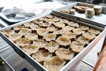 Sticky rice cake with shaded coconut filled for sell at Bangrak market, Bangkok, Thailand
