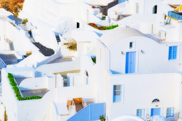 Oia town on Santorini island, Greece. Traditional and famous white and rose  houses at sunny day