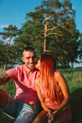 Smiling couple in love, outdoors, having joyful moment together
