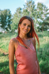 Portrait of stylish pink hair girl in the forest