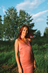 Portrait of stylish pink hair girl in the forest