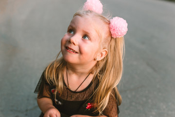 Portrait of child girl with blonde hair and blue eyes 