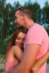 Smiling couple in love, outdoors, having joyful moment together