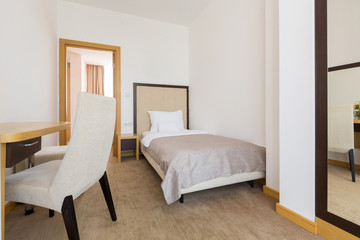 Fototapeta na wymiar Interior of a single bed hotel bedroom