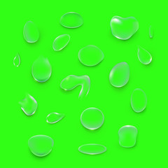 Transparent Water droplets, on a green background.