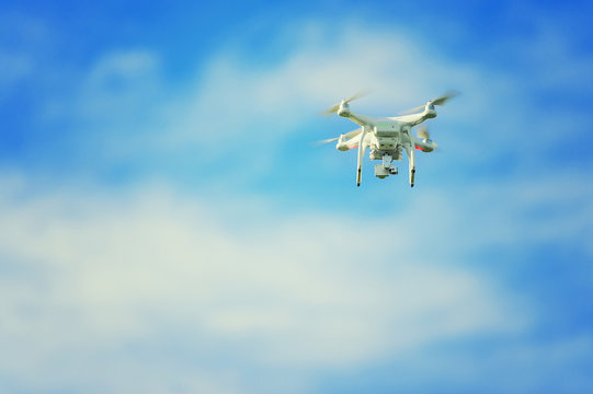 Drone on blue sky and white cloud background.
