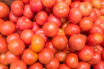 Pile of fresh red tomatos at the market.
