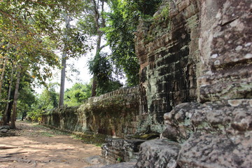 Ruins and walls of an ancient city in Angkor complex, near the ancient capital of Cambodia - Siem Reap