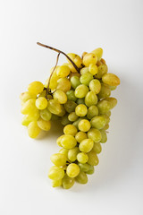 Closeup of green grapes on white background