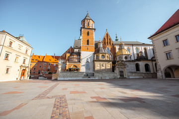 View on the inner courtyard of Wawel castle with chapels and Basilica of saint Stanislaus and Wenceslaus during the sunny morning in Krakow
