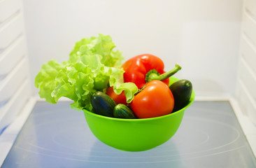 Summer vegetables in white refrigerator