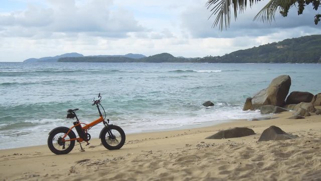 Electric Bike Parked on a Sandy Tropical Beach