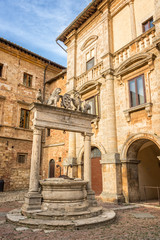 Fototapeta na wymiar The Griffin and Lion well in the old medieval town of Montepulciano in Tuscany Italy. Montpulciano is famous for its wine.