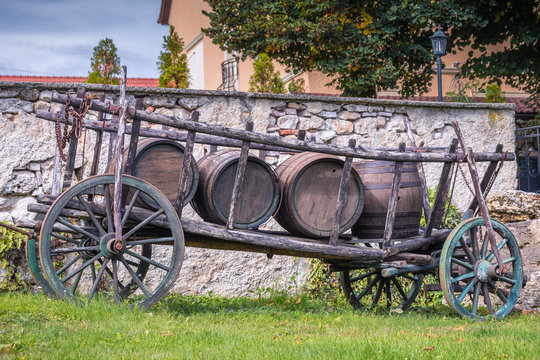 Wooden horse carriage loaded with barrels.