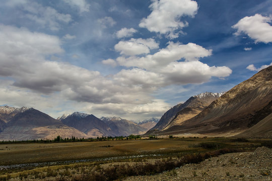 The desert and the mountains of the Nubra valley in cloudy weather