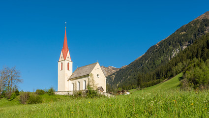 Fototapeta na wymiar Church of the village in South Tyrol, Racines, Trentino Alto Adige, Italy