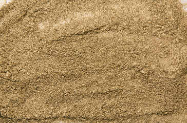 Golden dust texture. Bright shine. Golden powder surface. Yellow glitter. Shining sequins background.