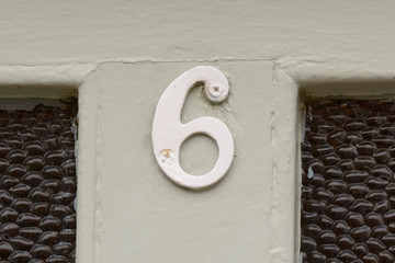 House Number 6 sign on door