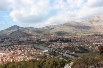 Fototapeta na wymiar Old European city in the valley between the mountains