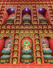Wall with small colorful Buddha statues inside  the Buddha Tooth Relic Temple and Museum in Singapore Chinatown