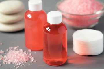 Fototapeta na wymiar Products for body care, shower gel, shampoo, bath salts. Pink color
