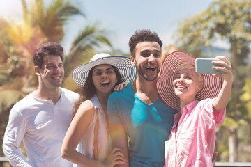 Cheerful Group Of People Making Selfie Photo Portrait Happy Smiling Mix Race Man And Woman Making Self Picture Over Tropical Forest Background